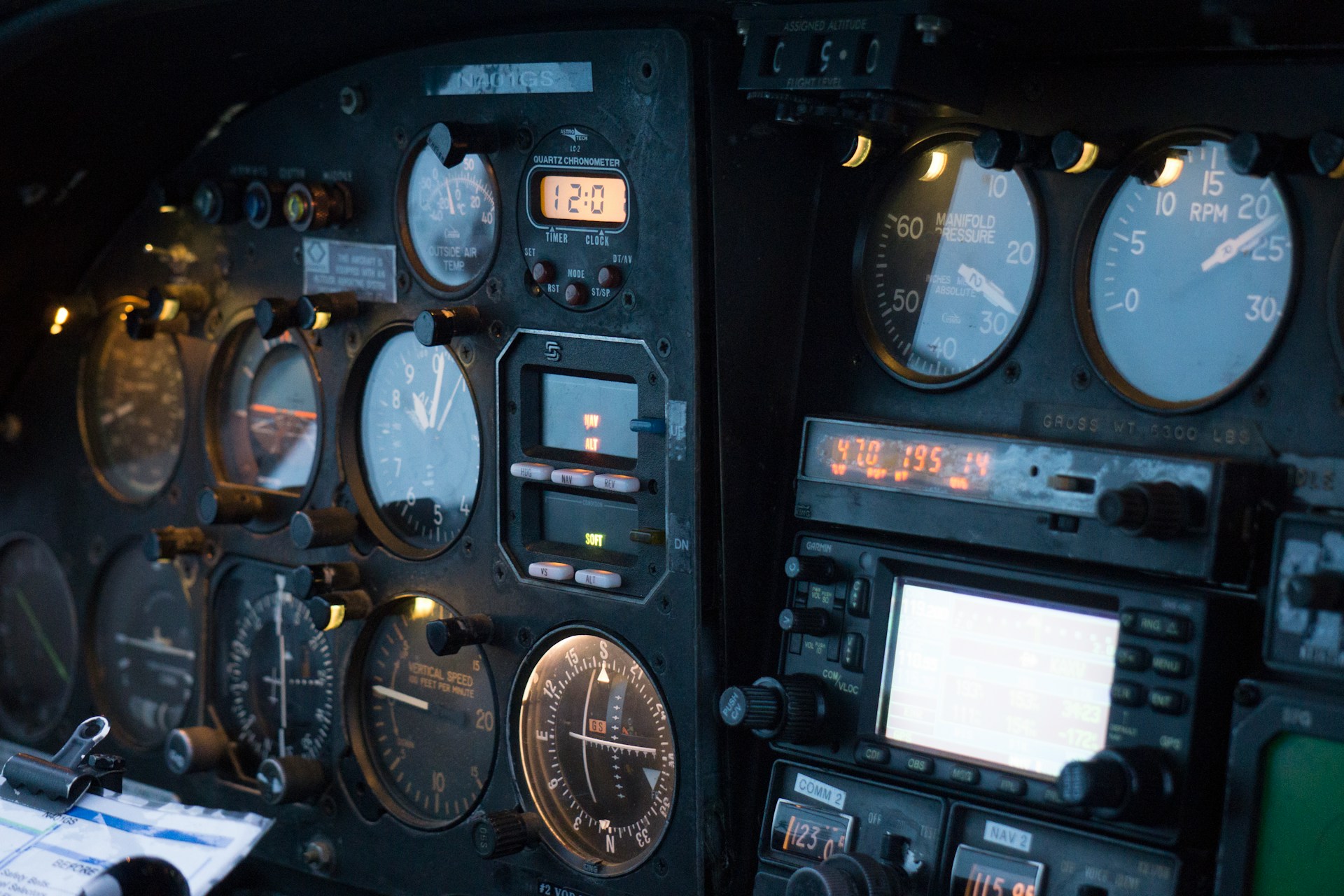 Close-up of an aircraft cockpit instrument panel showing multiple gauges and dials, all displaying readings but none showing the destination